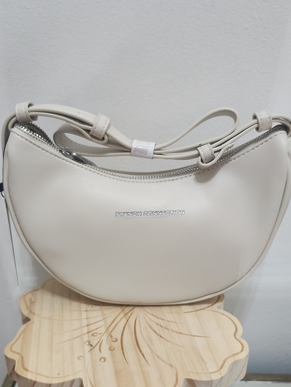 French Connection Cream Crescent Shoulder Bag with Silver Logo Oat Milk Color